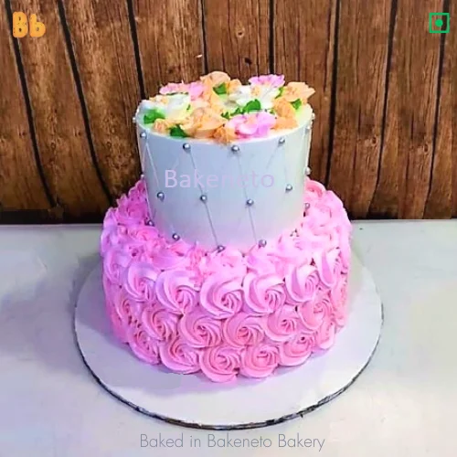 Order this 2 Tier Pink Floral Cake Online and the get same day cake delivery in Noida, Ghaziabad, Vaishali, Vasundhara, Gaur city, Noida Extension and Delhi. Visit bakeneto.com and checkout all types of theme cakes online.